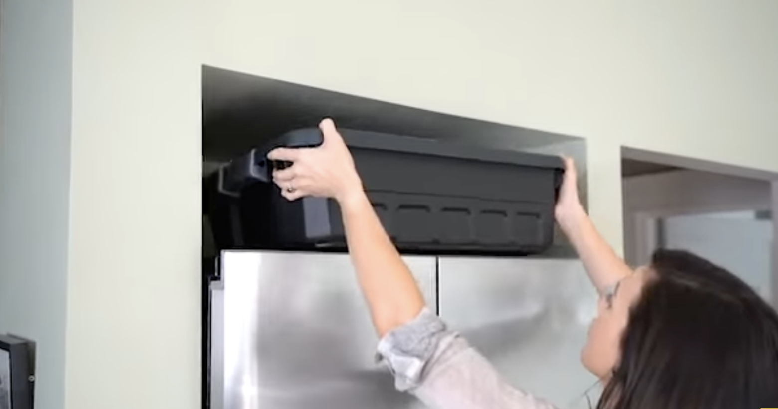4Patriots Slim-Line covert totes stored near a refrigerator